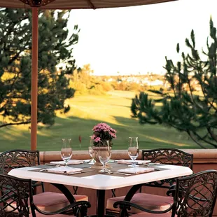 The Clubhouse Grill terrace with views of The Grand Club&apos;s 18th hole.