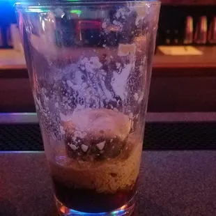 a shot of a drink in a glass