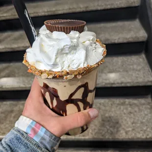 Peanut butter milkshake with a Reese cup to top it off