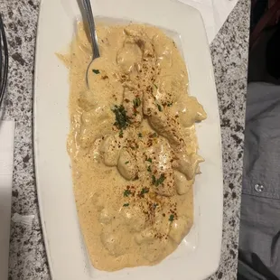 a white plate of food on a table