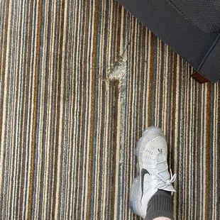 Large half arrow shaped gauge in the carpet.