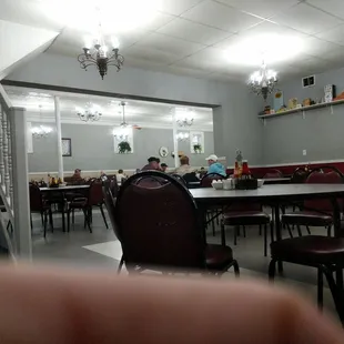 a dining room with tables and chairs