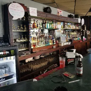 a bar filled with bottles of alcohol