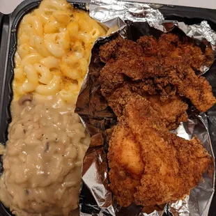 Mac and cheese, rice and beans with gravy, fried chicken thigh and fried chicken breast