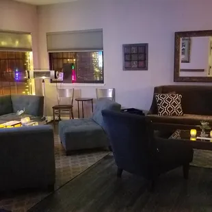 a living room with blue couches