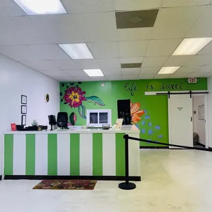 a green and white reception area