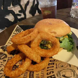 An amazing !!!! avocado, burger and onion rings.