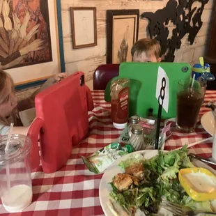 two children eating at a restaurant