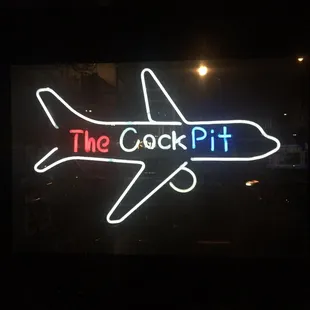 a neon sign of an airplane