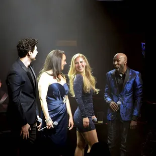 The cast enjoys and ovation