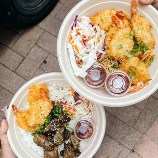 two plates of food being served