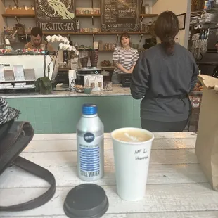 a woman standing at the counter