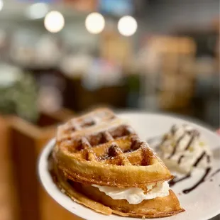 a plate of waffles and ice cream