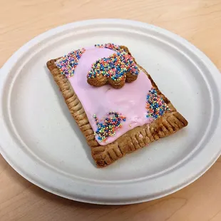 04/25/22 Circus Animal Cookie Poptart - Raspberry Cookie Cream Filling, Raspberry Icing, Circus Animals Sprinkle Cookies