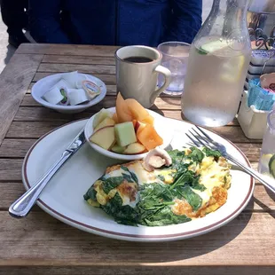 Spinach &amp; Mushroom Omelette loaded with cheese. Enjoyed outside dining.