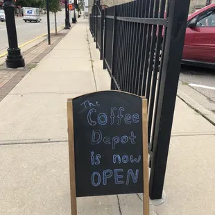 a sign on the sidewalk