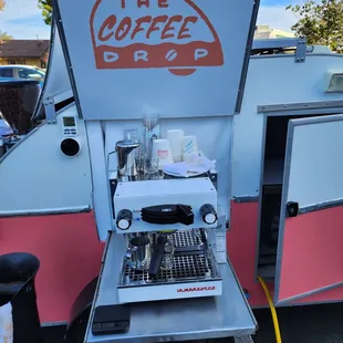 a coffee machine in a parking lot