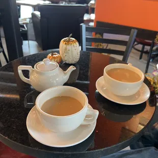 two cups of coffee on a table