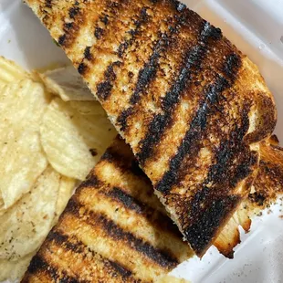 Burnt sourdough bread and chicken jerky with stale chips.