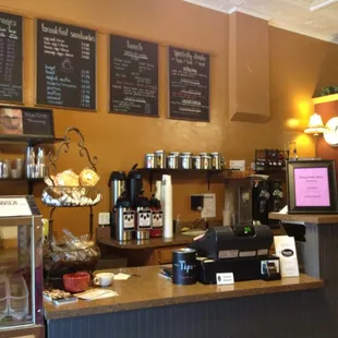a coffee shop counter and menus