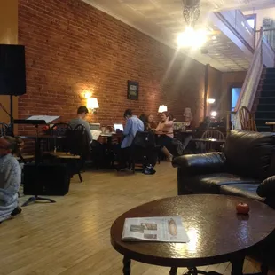 a group of people sitting around a coffee table