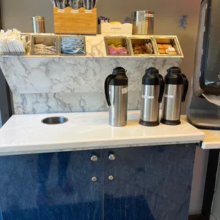 Creamers, sugars and utensil counter