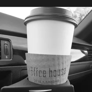 a cup of coffee in a cup holder