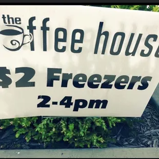 a sign for $ 2 freezers