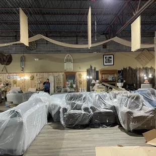 a lot of furniture in the warehouse