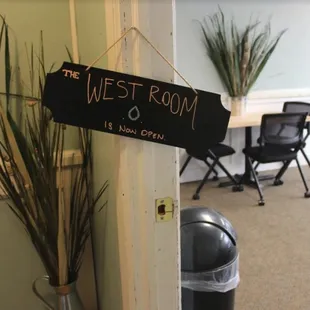 a sign hanging on the door