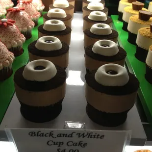 a display of cupcakes and pastries