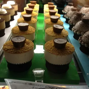 a display of cupcakes and pastries