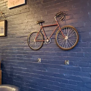 a bicycle mounted on the wall
