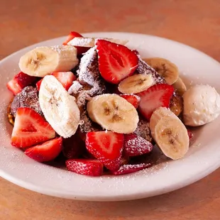 strawberries, bananas, and powdered sugar