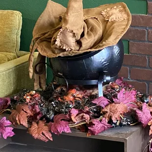 a witch&apos;s hat on top of a cauldron