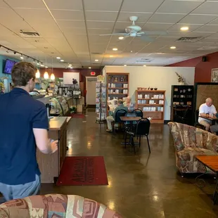 a man standing in a coffee shop