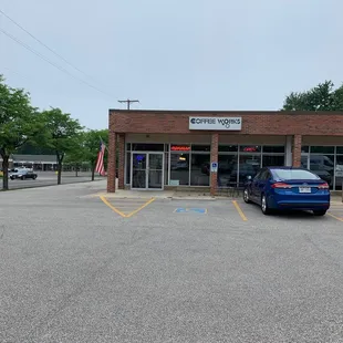 a blue car parked in a parking lot