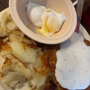 country fried steak with perfectly poached eggs, rye toast and of course, the perfectly cooked home fries,