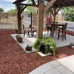 a patio with a table and chairs