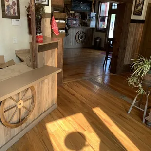 a wooden bar with a wheel on the counter
