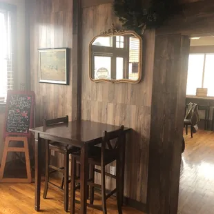 a wooden table and chairs