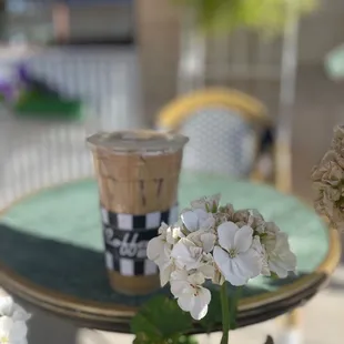 a cup of coffee and flowers