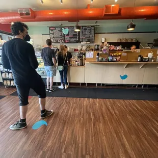 people standing in line at the counter