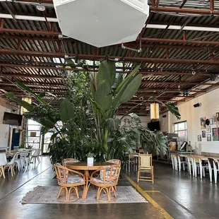 a table and chairs in the middle of the room
