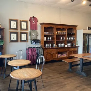 Additional seating inside and coffee and items for sale.