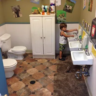 Cole washing his hands in the Toddler bathrooms before lunch