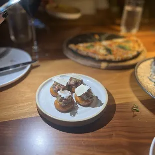 Beef tartar in crispy bao and shaved parmesan