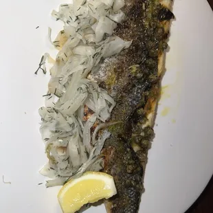 Branzino with crispy capers and pickled fennel.