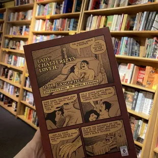 a hand holding a book