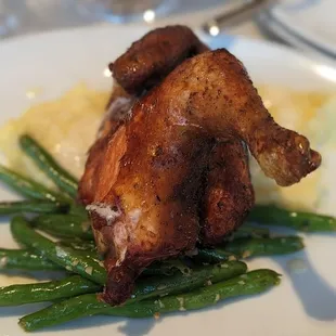 Half of chicken with green beans and mashed potatoes